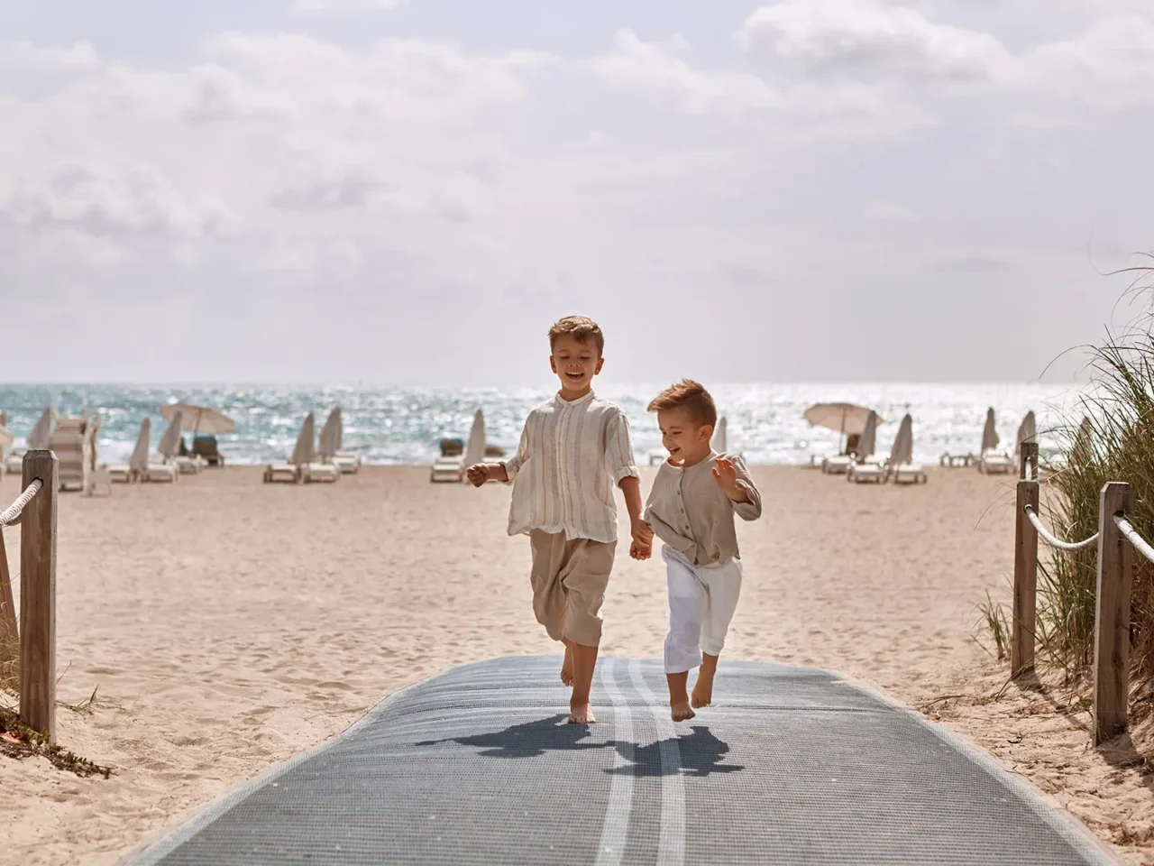 Cute Boys Running on a Beach