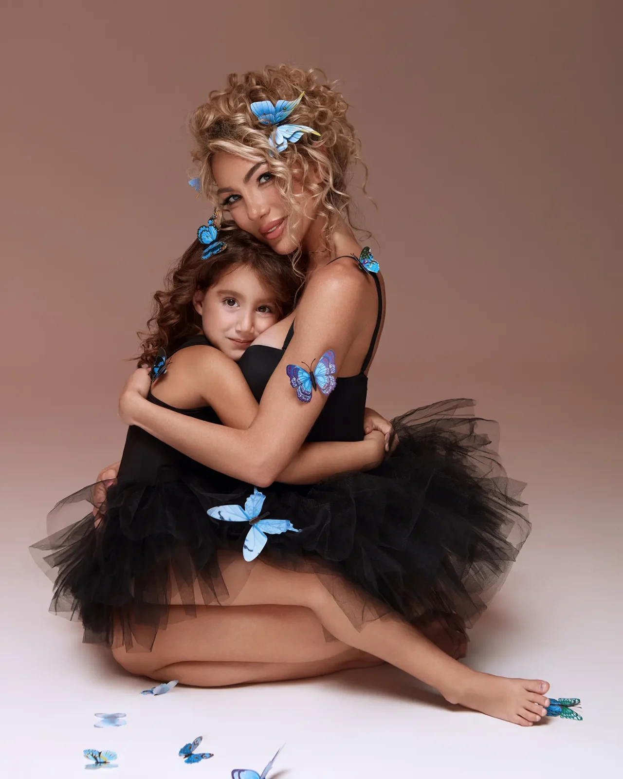 Mother and daughter photo with butterflies